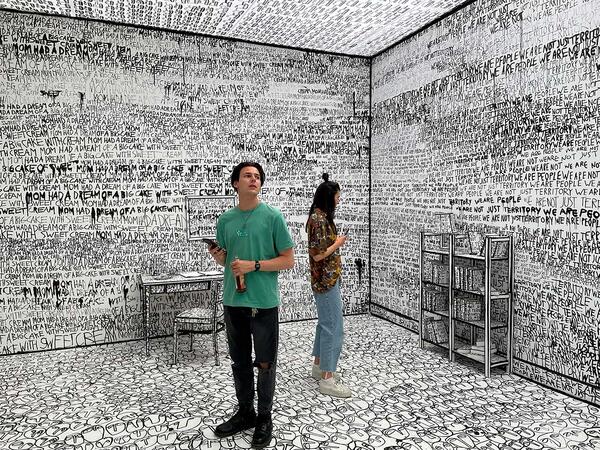 People standing in an exhibition