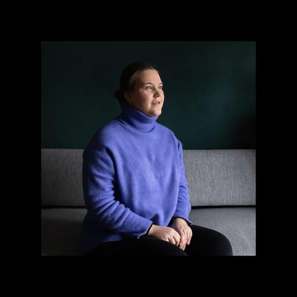 a woman sitting on a couch 